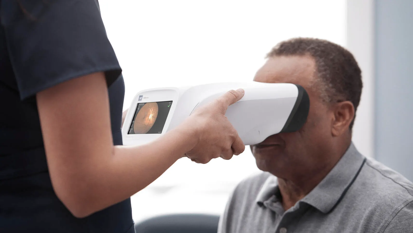 Patient receiving diabetic retinal exam
