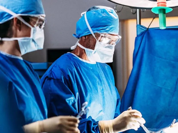 Surgeons operating on a patient