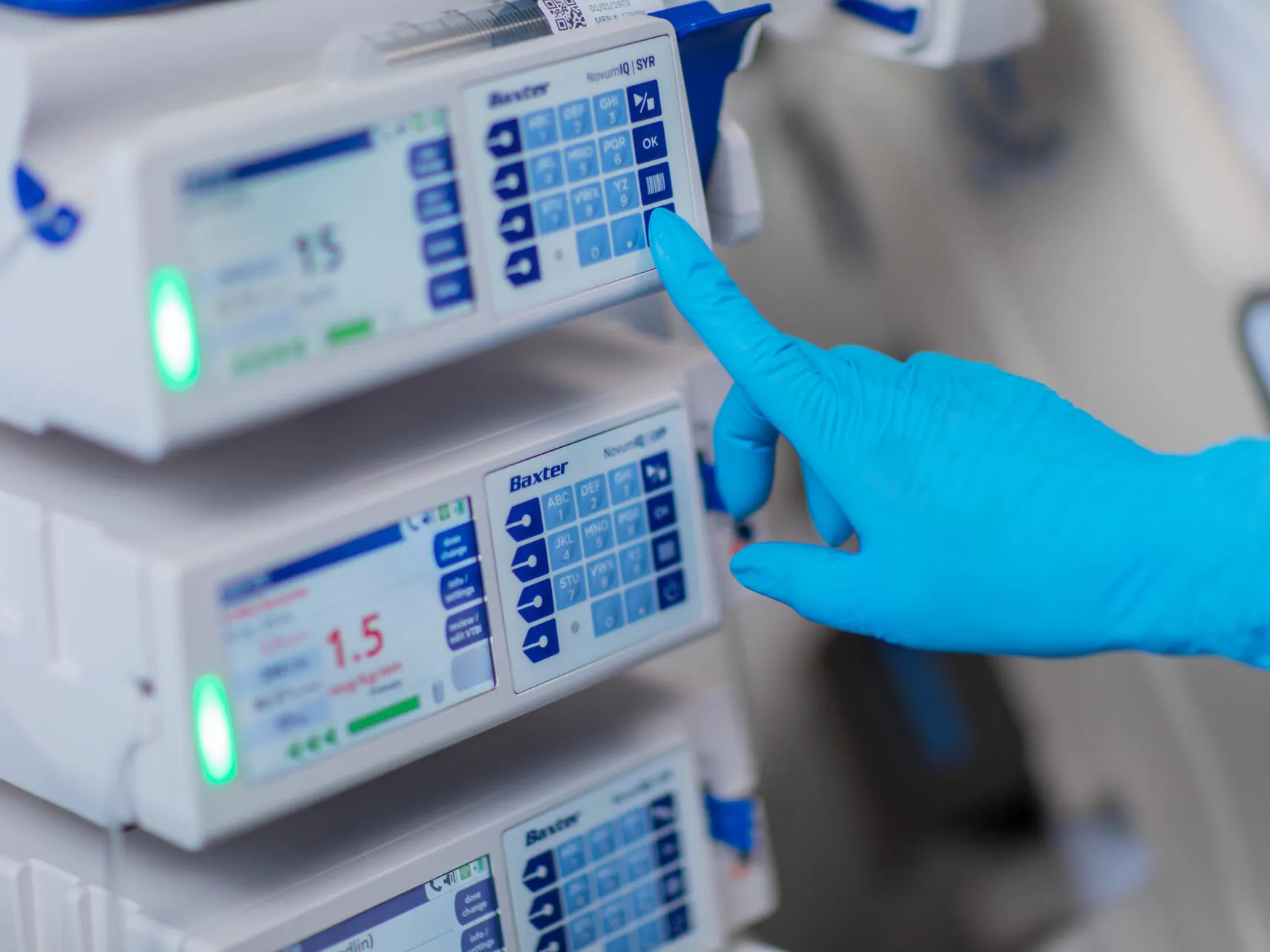 Healthcare provider setting up Baxter equipement